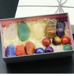 Chakra crystal gift set with natural raw stones and polished spheres in a premium box