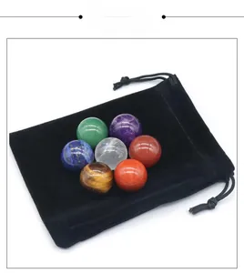 Polished natural crystal energy stones set with a black velvet storage pouch
