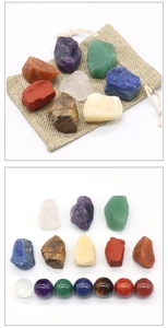Detailed view of 7 chakra natural raw crystals and matching polished stone spheres set
