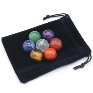 Natural crystal stone ball set with seven chakra gemstones and black velvet pouch