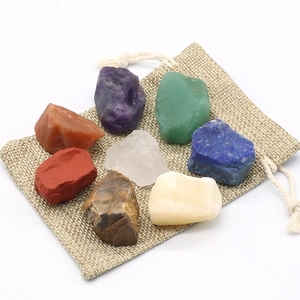 Natural 7 Chakra crystal stones set with raw minerals and a rustic linen storage pouch