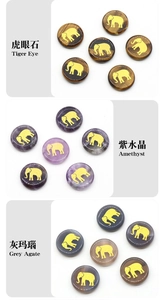 Detailed engraving of golden elephant on tiger eye, amethyst and grey agate stones