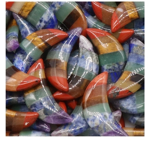 Detailed macro view of polished crescent moon stones made from layered seven chakra crystals