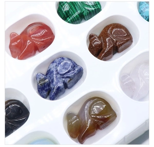 Macro view of various semi-precious stone fox figurines with polished natural textures