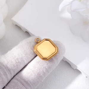 Macro view of golden square picture frame pendant with polished layered edges