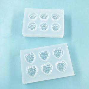 Detailed view of 6-cavity heart and floral silicone molds for miniature DIY food crafting