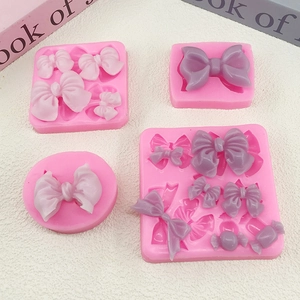 Pink silicone candy bow molds for DIY chocolate fondant cake baking and resin crafts