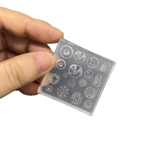 Transparent silicone mold featuring ancient Chinese coin and pendant patterns for DIY resin crafts