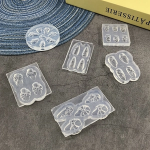 Transparent 3D silicone nail art molds featuring bows and droplets for creative DIY designs