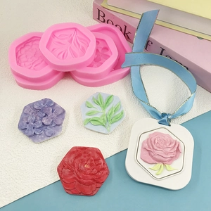 Silicone flower molds for making hexagonal plaster tags with embossed rose patterns