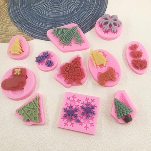 Christmas silicone mold set featuring tree and snowman shapes for DIY baking and chocolates