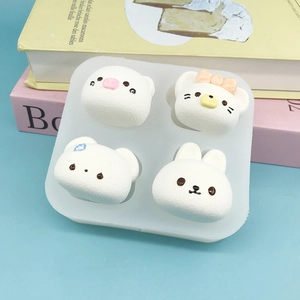 Silicone 4-hole mold for cartoon animal shapes like pig, cat, bear, and rabbit