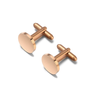 Macro detail of polished rose gold cufflinks with brushed metal texture and T-bar clasp