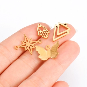 Gouden roestvrijstalen DIY bedels set met Hamsa hand, driehoek, ster en vlinder motieven