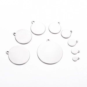 Set of nine polished stainless steel round blank tags in assorted sizes for DIY jewelry