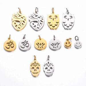 Detailed view of hollowed stainless steel charms including heart, skull, and owl patterns