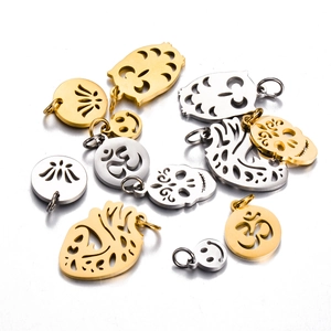 Mixed set of stainless steel charms with skull, smiley face and hollow heart designs