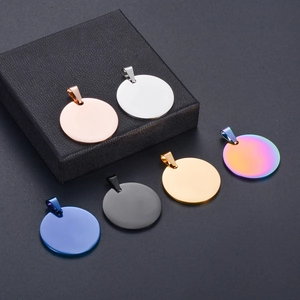 Detailed view of circular stainless steel pet ID tags in six diverse metallic finishes