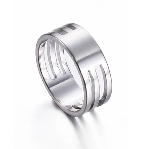 Close-up of polished stainless steel jump ring opener tool with three vertical slots