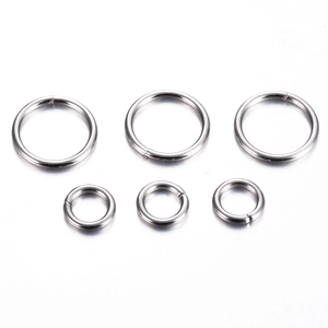 Close-up of polished stainless steel open rings in two sizes for DIY jewelry making