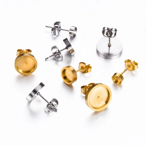 Detailed view of gold and silver stainless steel flat pad earring posts with butterfly backs