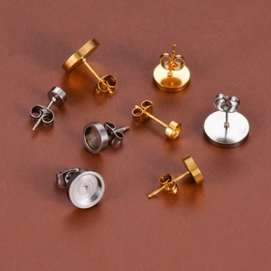 Stainless steel DIY earring studs with flat pads and butterfly backs in gold and silver