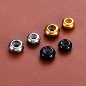 Macro view of assorted stainless steel spacer beads with silicone stoppers for DIY bracelets