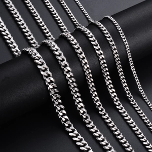 Comparison of different widths of stainless steel Cuban link chains on a black display stand