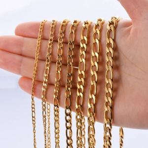 Golden Figaro chain necklaces in seven varying widths shown on hand for scale