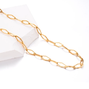 7mm gold hollow diamond-shaped stainless steel link chain on white stone block