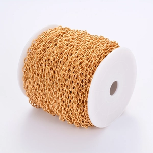 Golden stainless steel cross chain roll for DIY jewelry making on white plastic spool
