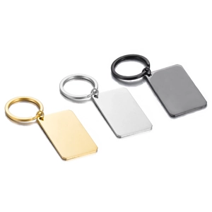Detailed view of rectangular stainless steel keychains in gold, silver and black finishes