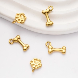 Dijes de acero inoxidable dorado con forma de pata y hueso para collares DIY