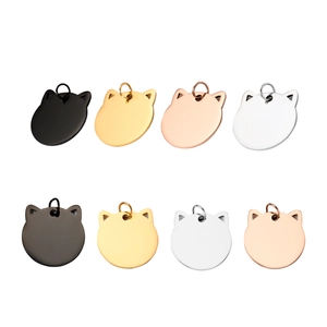 Detailed view of cat-shaped stainless steel pet ID tags in four polished metallic finishes