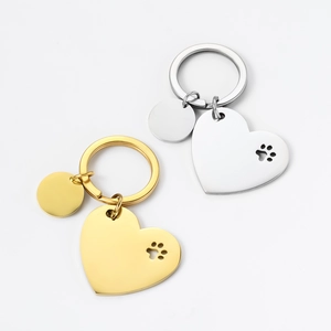 Polished stainless steel heart keychain with hollow paw print and round tag detail