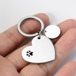 Polished stainless steel heart and circle pet ID tag with black paw print engraving