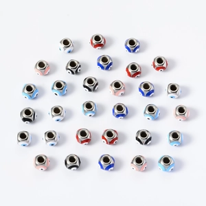 Detailed view of 8mm stainless steel evil eye spacer beads with multi-color enamel inlay