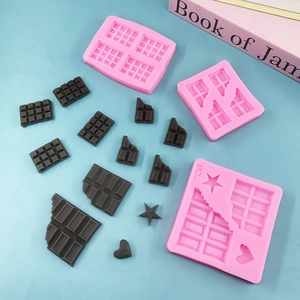 Pink food grade silicone chocolate molds with star heart patterns and square grid designs