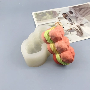 Detailed view of puff pastry silicone mold and finished stacked cream dessert model