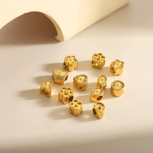 Exquises perles d'espacement en métal doré en forme de fleur et cœur pour bijoux DIY