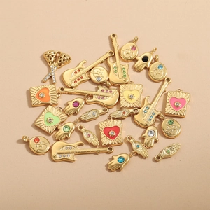 Golden Hamsa hand and electric guitar charms with colorful zircon stone inlay