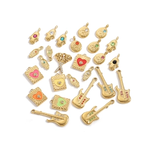 Vintage golden stainless steel pendants collection with guitar and Hamsa hand motifs
