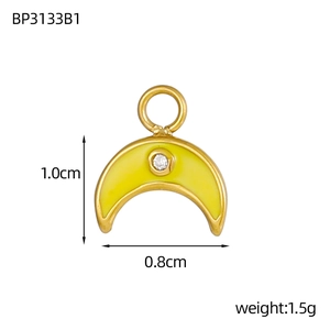 Golden crescent moon pendant with yellow enamel and zircon inlay on white background