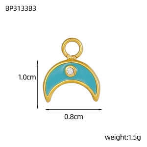 Macro shot of 1cm light blue enamel crescent moon pendant with gold plating and zircon