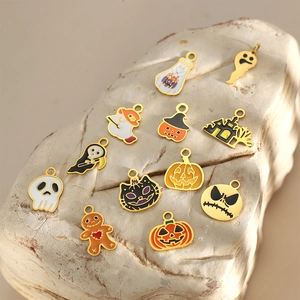 Halloween enamel charm set with pumpkin, skull, and black cat on stone texture