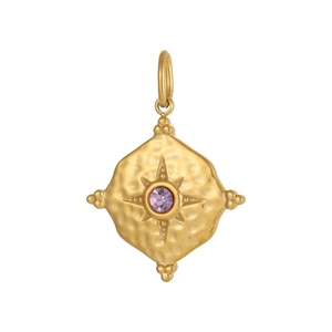 Macro shot of hammered gold rhombus pendant with faceted purple gemstone in star setting