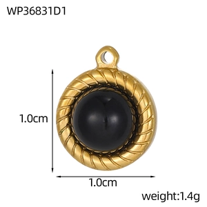 Macro shot of 1.0cm gold round stainless steel pendant with black stone and twist edge