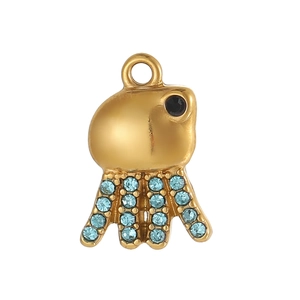 Detail of gold octopus pendant with blue crystals and a black gemstone eye for jewelry