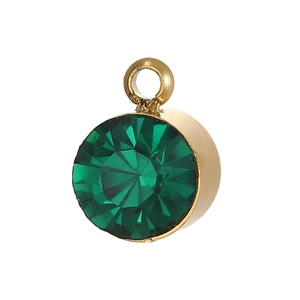Detail of round green crystal pendant with gold plating and faceted stone for DIY jewelry