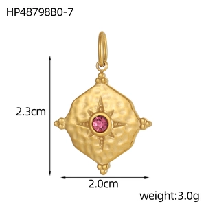 Macro view of hammered gold oval pendant with purple birthstone and dimension markings